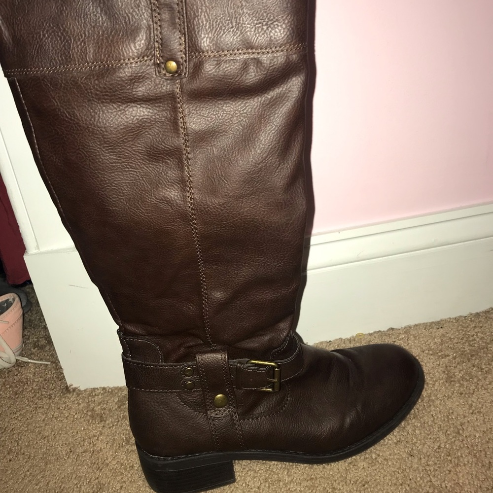 Tall brown buckle boots